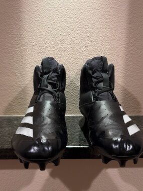 Black Mens Size 11 Football Cleats with White Stripes